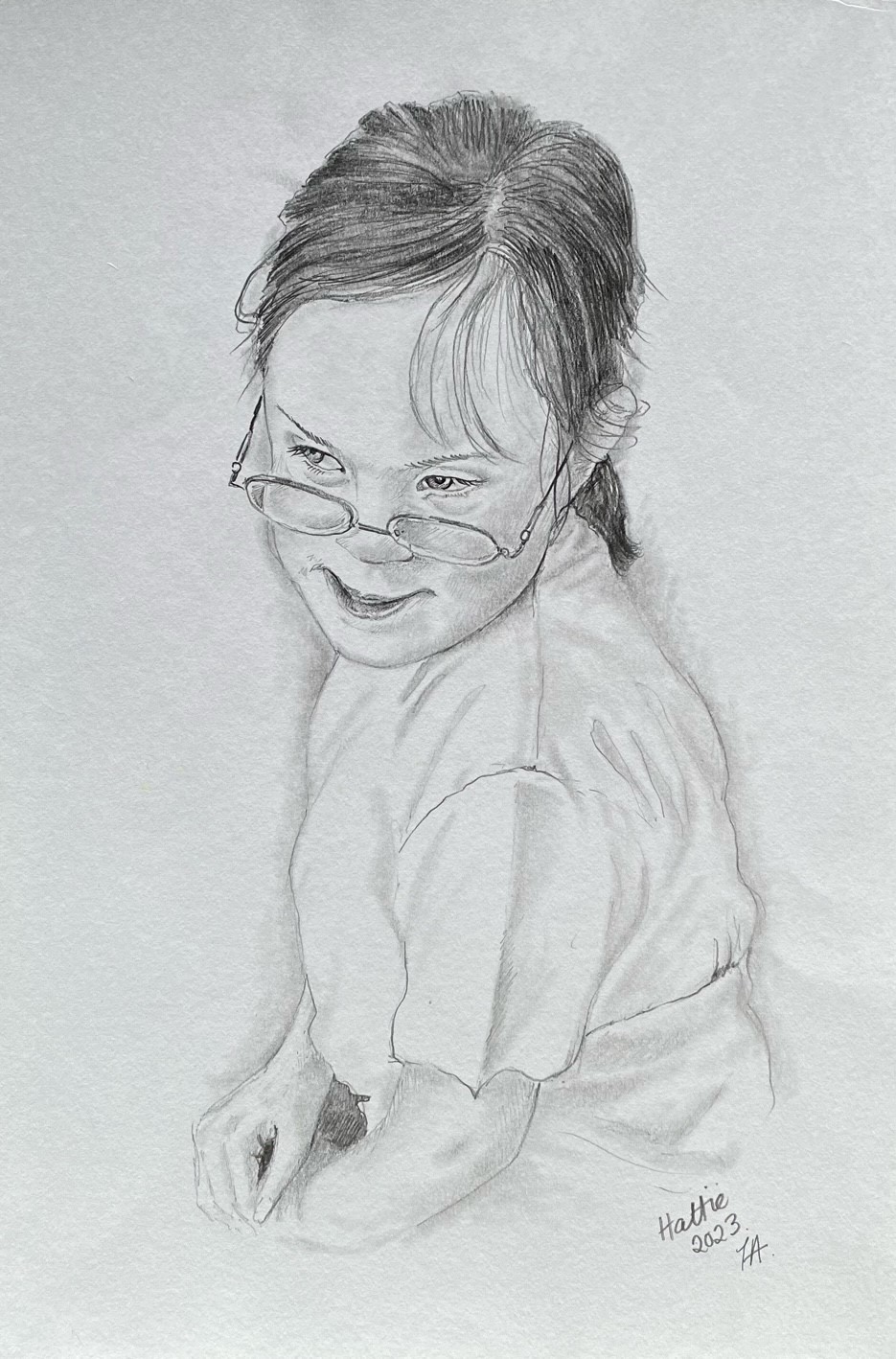 A pencil sketch of a young girl wearing glasses and a tshirt. Her hair is in a ponytail.