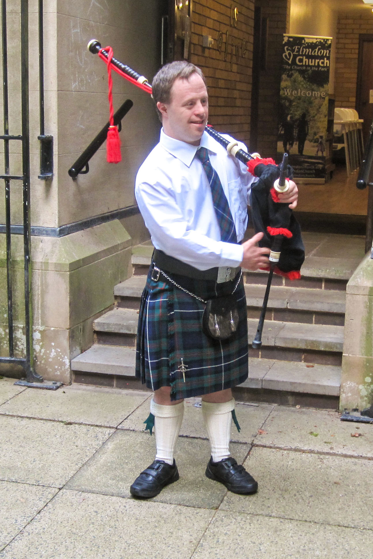 Young man playing the bag pipes