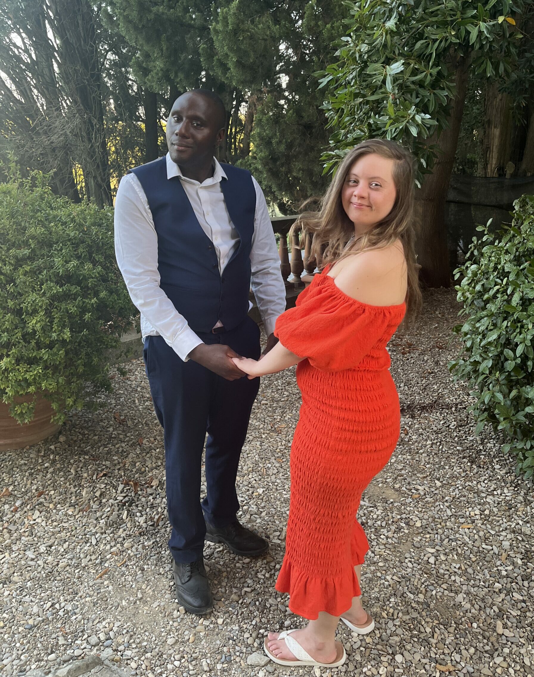 Young woman in red dress and man in a suit