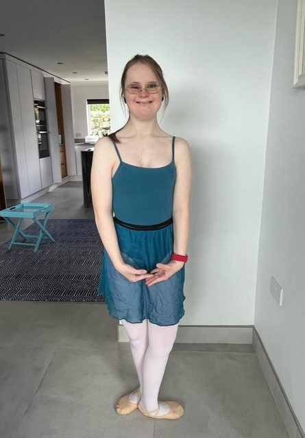 Girl wearing a blue ballet costume