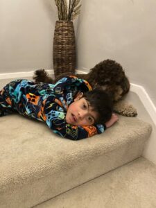 Jesal on the floor with his dog
